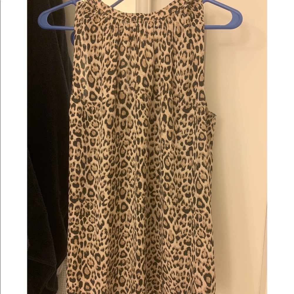 Leopard print blouse with tie in back.